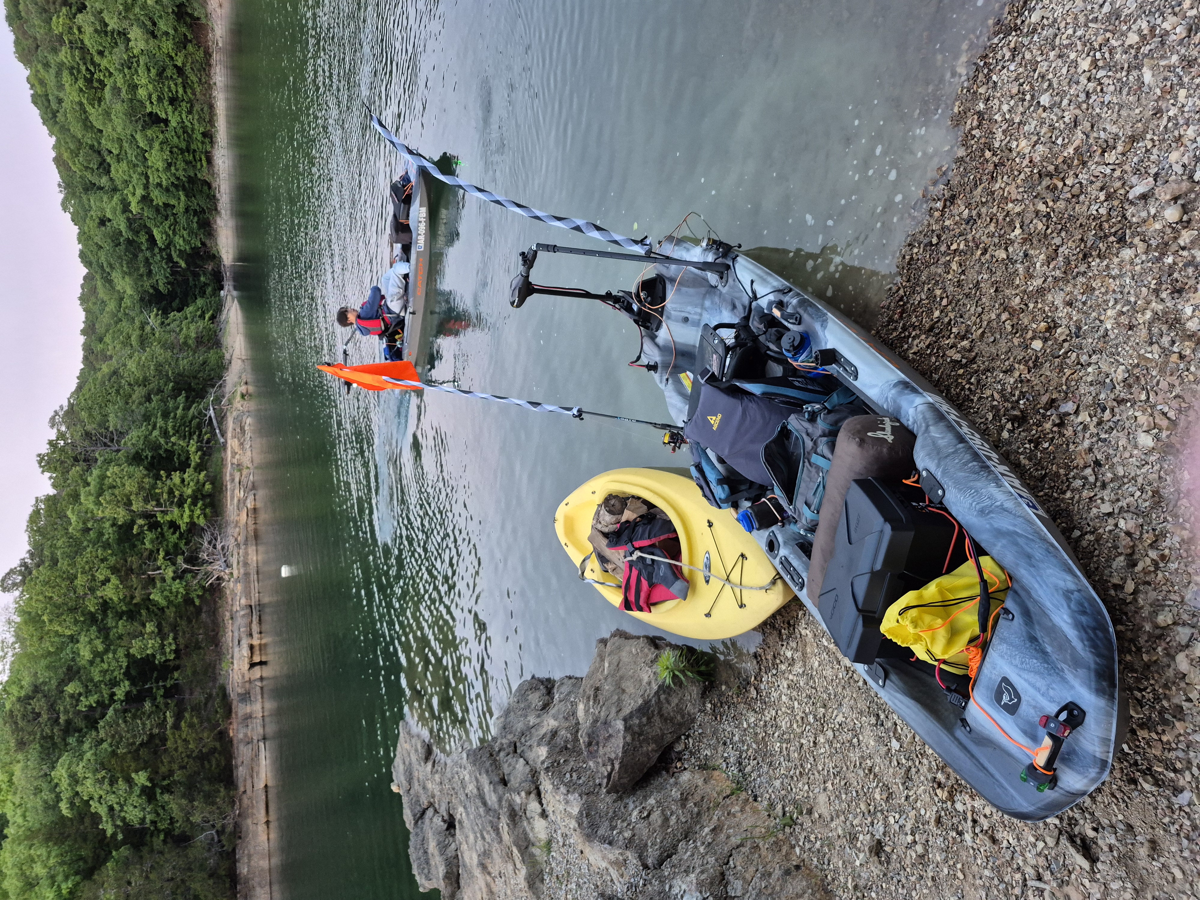 Beaver Lake from the water — the kayak brigade packed and ready to depart